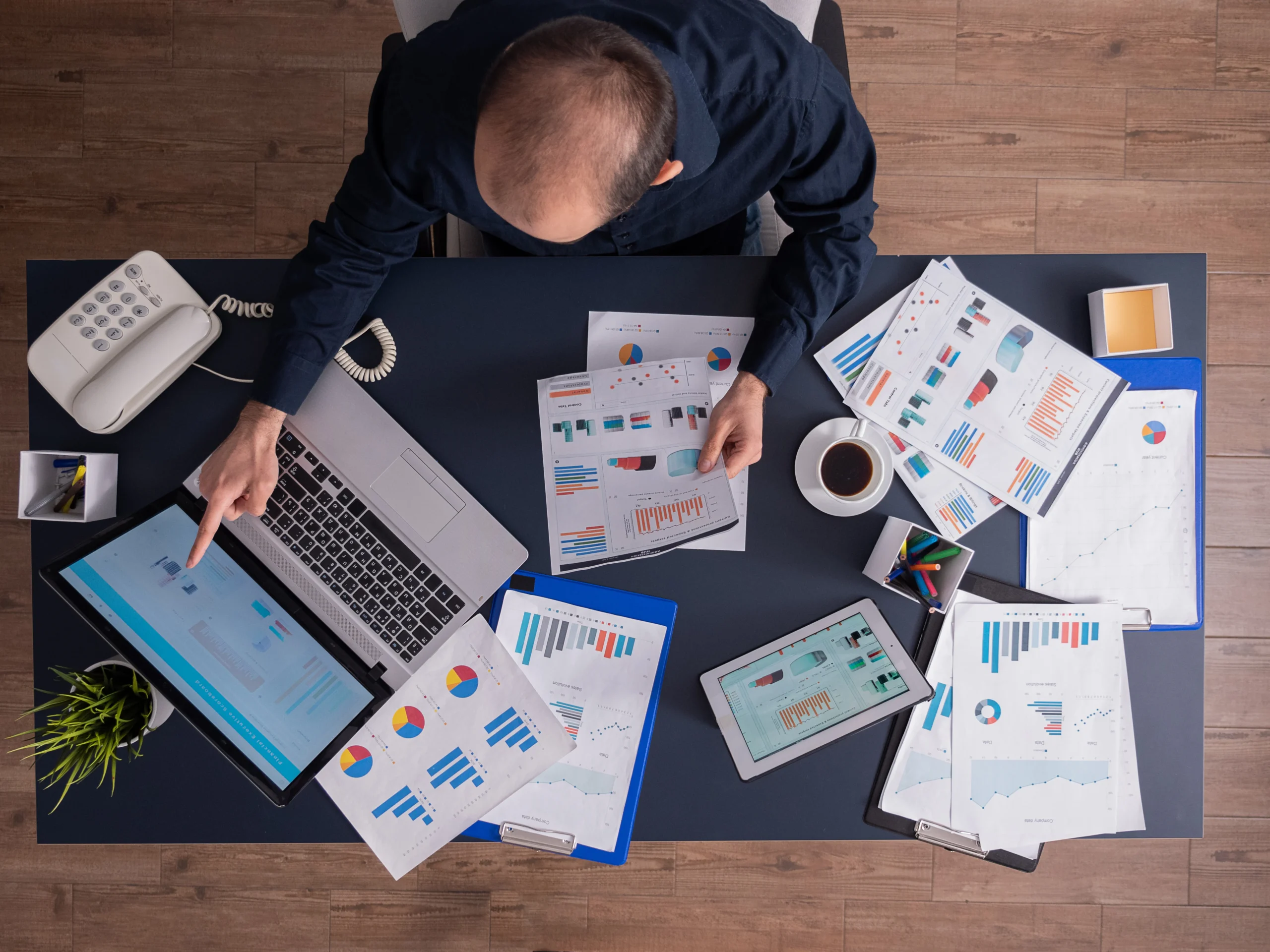 Top View Businessman Pointing Financial Statistics